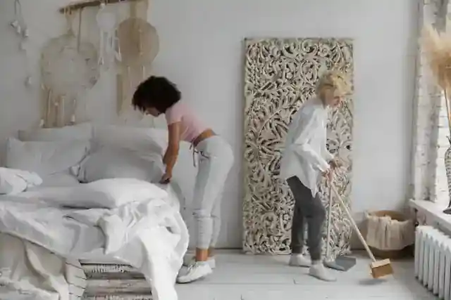 A bedroom being cleaned during an apartment turnover